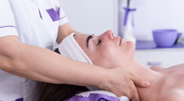 Professional facial and neck massage training in a spa setting